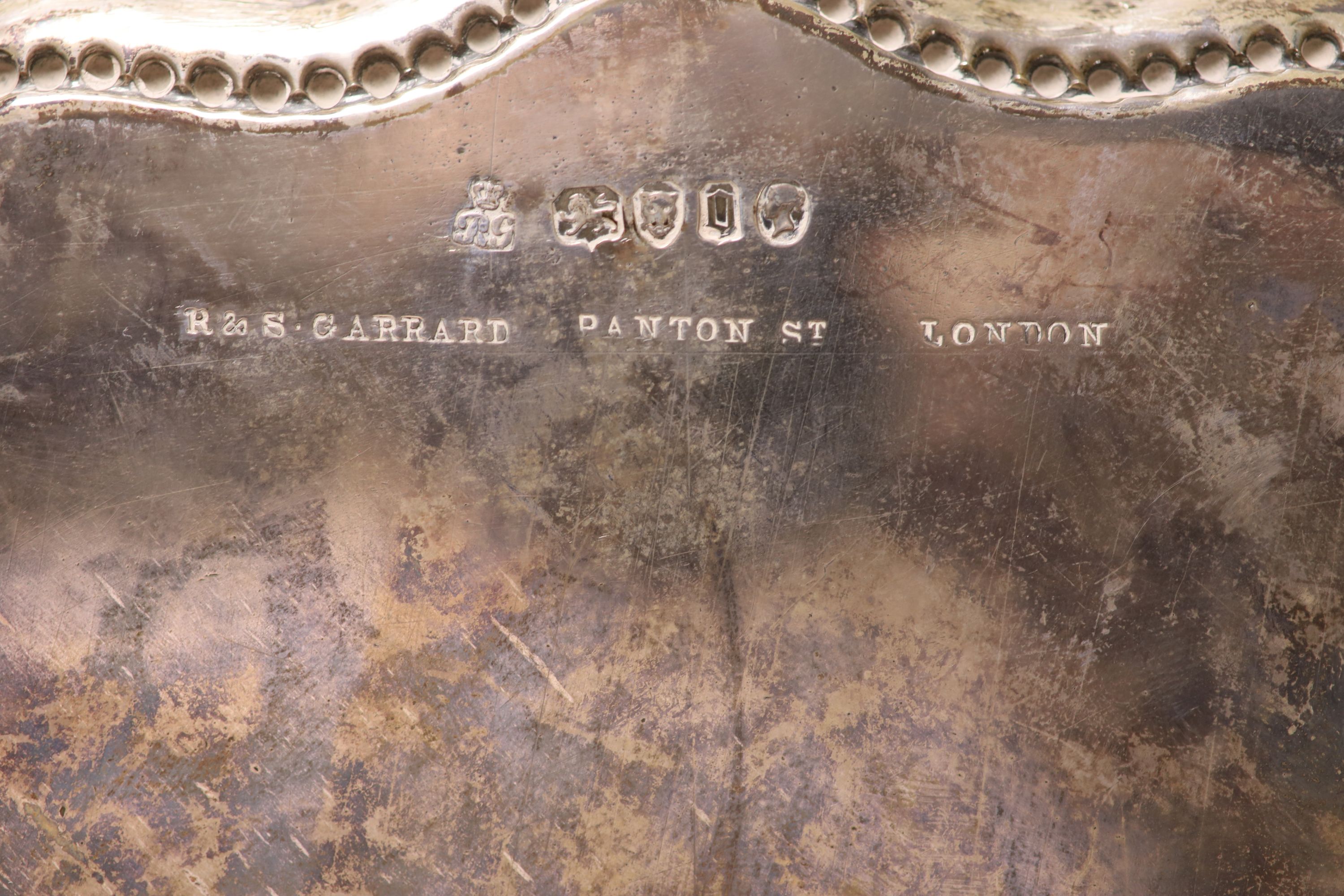 A Victorian silver salver, with engraved inscription, Robert Garrard II, London, 1869, 31.1cm, 27oz.